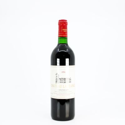 a bottle of wine that is sitting on a table