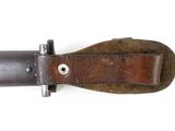 a close up of a knife on a white surface