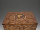 an image of a wooden box with a bird on it