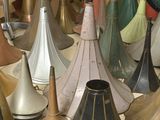 a lot of different types of bells on the floor