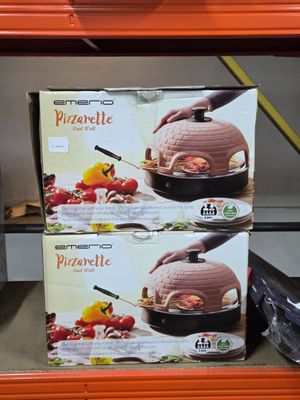 two boxes of pizza sitting on a shelf in a store