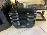 many trays of food sitting on the floor in a store