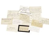 a pile of old papers with handwriting on them