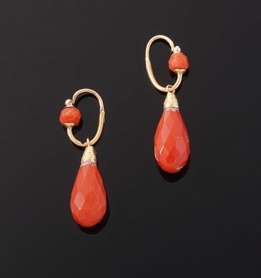 a pair of coral and gold earrings