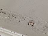 a close up of a piece of furniture with peeling paint on it