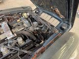 an old car with a broken hood and a broken engine