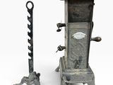 paire de poêles à charbon anciens en fonte, avec poignées en fonte