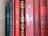 a box full of books that are sitting on a shelf