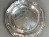 a silver plate that is sitting on a table