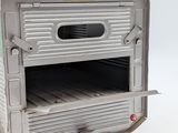 a silver oven that is open on a white surface