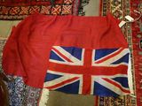 a british and british flag on a rug on the floor