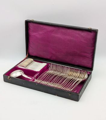 silverware in a black case with purple lining on a white background