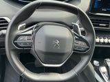 the interior of a car with a steering wheel and dashboard controls