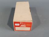 an empty box sitting on top of a table on a gray surface