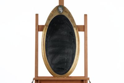 a wooden stand with a mirror on it and a clock on it