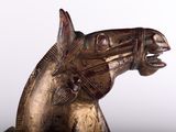 statue of a horse head on a stand with a white background