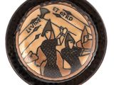 a plate with a picture of a man and a woman on it