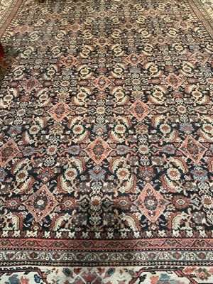 an image of a large oriental rug on the floor in a living room