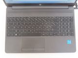 a laptop computer with a keyboard on a white surface
