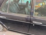 a car that has a broken door and a broken window