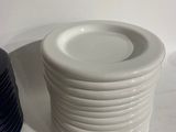 a stack of plates sitting next to each other on a table