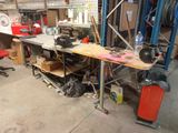 an image of a workbench in a garage with a lot of clutter