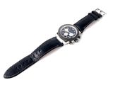wrist watch with black leather strap on a white background