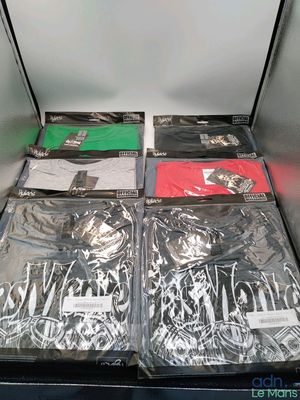 many different types of clothing in a metal container
