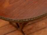 a close up of a wooden table on a hard wood floor
