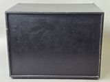 a black box that is sitting on a white surface