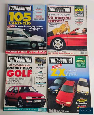 four magazines of different cars on display on a white surface