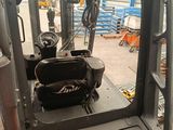 a forklift that is parked in a warehouse