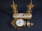 a clock that is sitting on top of a table