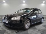a picture of a black car parked in a showroom