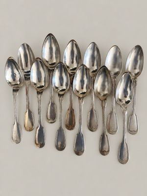 a lot of spoons that are sitting on a table