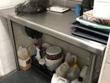 a kitchen with a stainless steel counter top and a sink