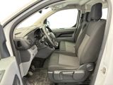 the interior of a white truck with the driver ' s seat up