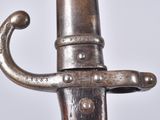 a close up of a silver sword with a metal handle