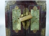 a wooden box that has a lock on it