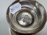 a silver cup that has a price tag on it