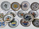 a lot of plates that are sitting on a table