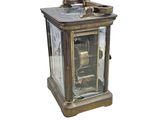 a small clock that is sitting on a table