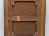 an old wooden picture frame with a square hole in the middle of it