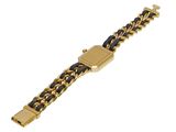 an image of a gold and black bracelet on a white background