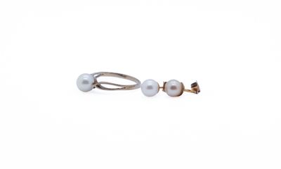 pair of pearl earrings on a white background