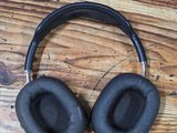 headphones on a wooden table with a wooden surface