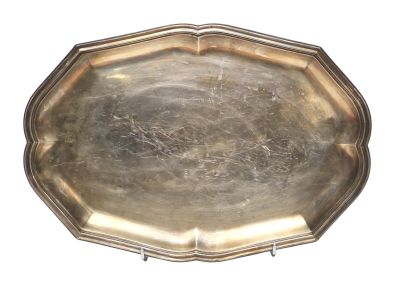 silver plate on a stand on a white background with a white background