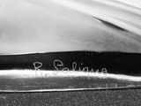 black and white photograph of a close up of a knife on a table
