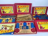 six boxed boxed boxed toys including a train, a clock, a clock tower, and a box of magnets
