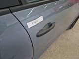 a sticker on the door of a car with a sticker on it